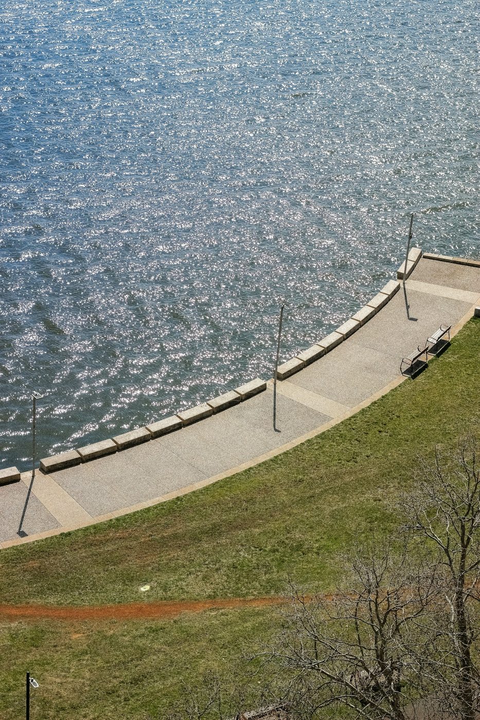 A paved path curving beside Lake Burley Griffin