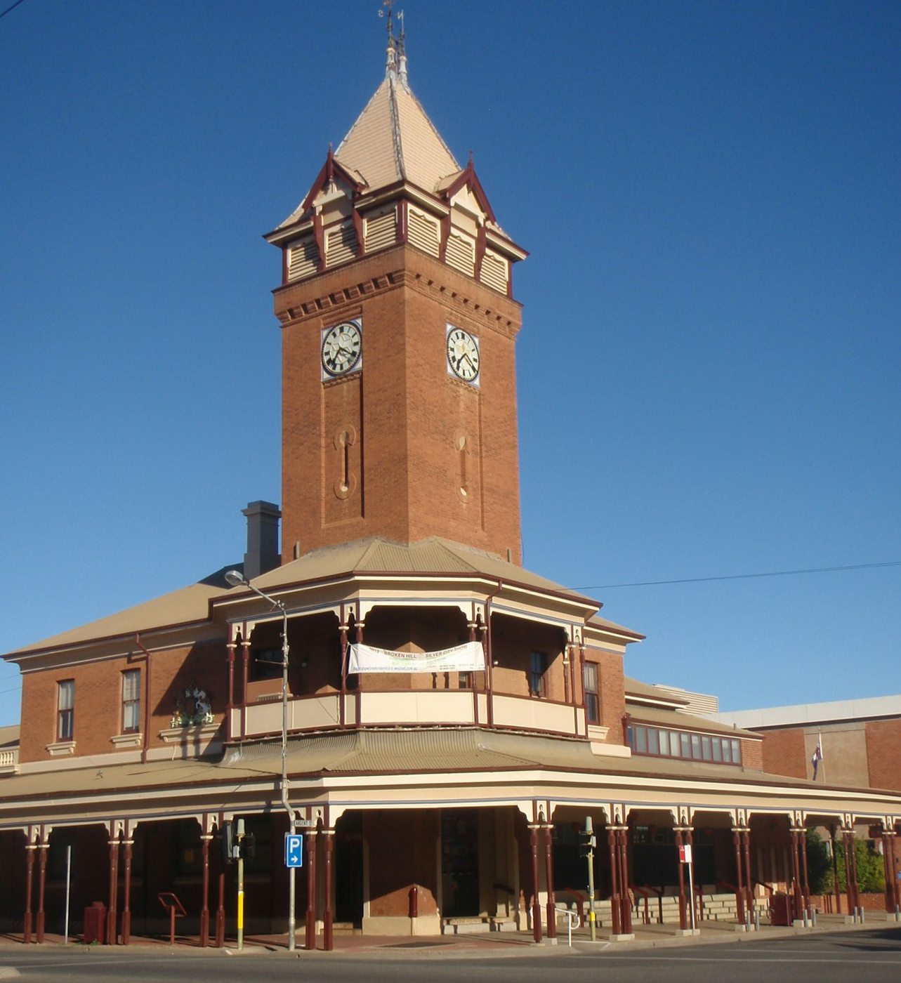A red brick clock tower on a historic Broken Hill building