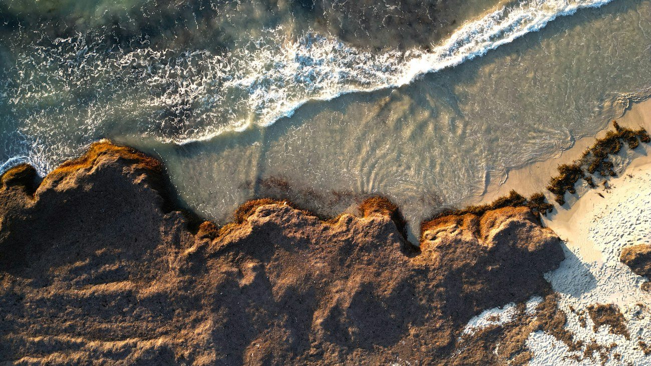 Surf washing around rocks at Cottesloe