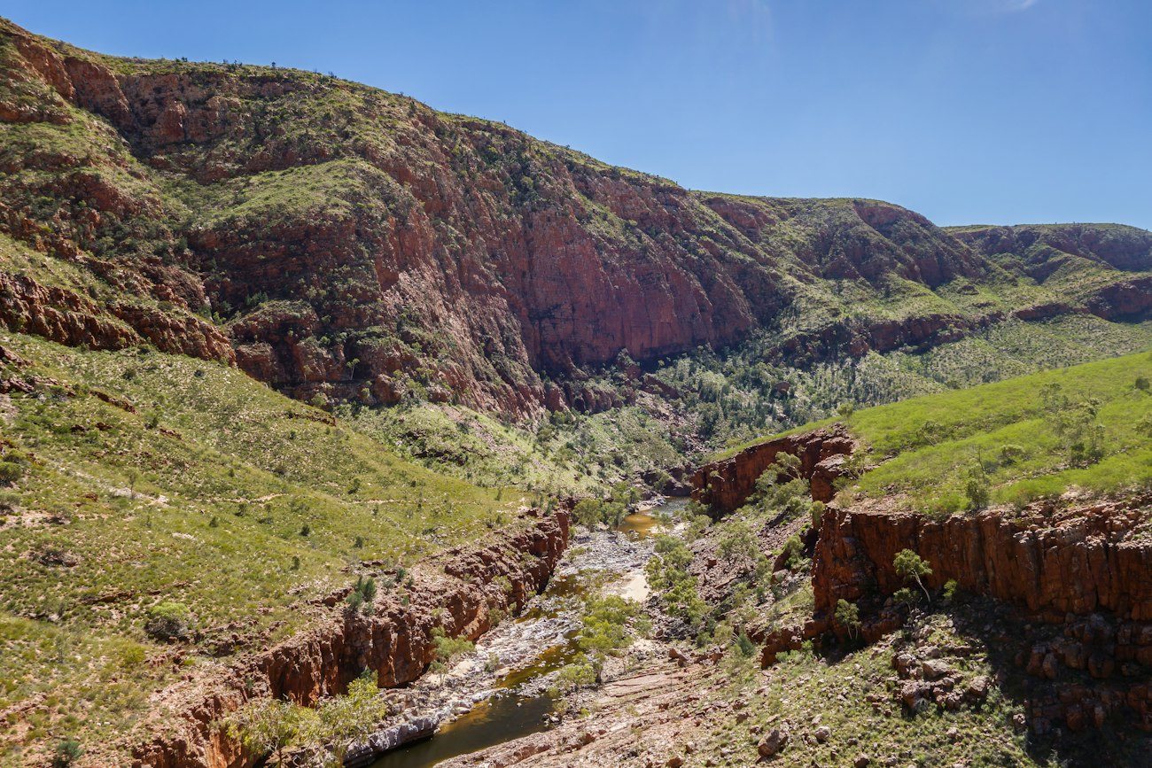 A rocky valley and vegetation in the West MacDonnell Ranges