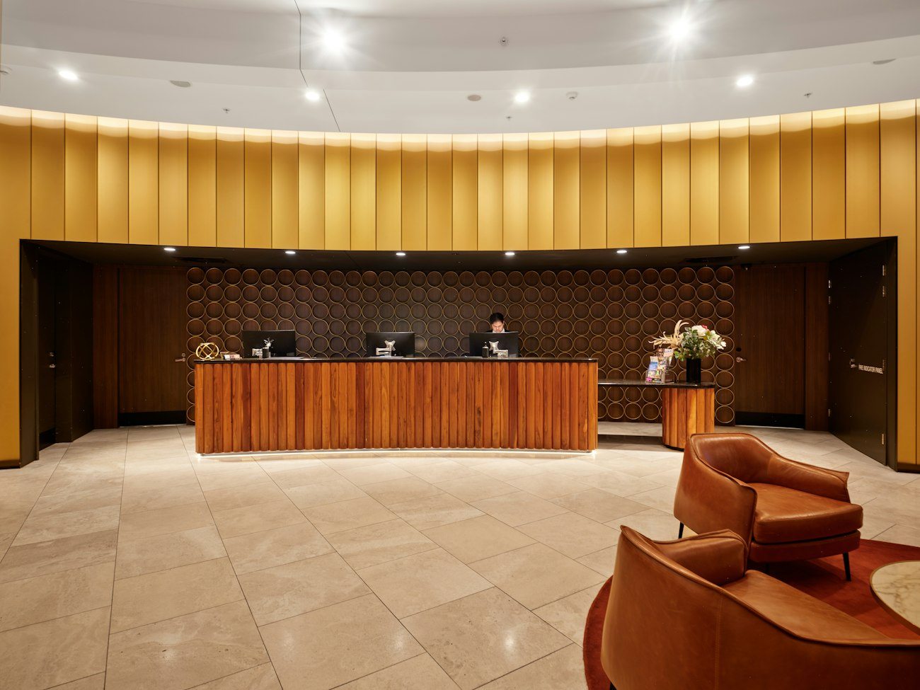 A hotel reception desk and lobby seating
