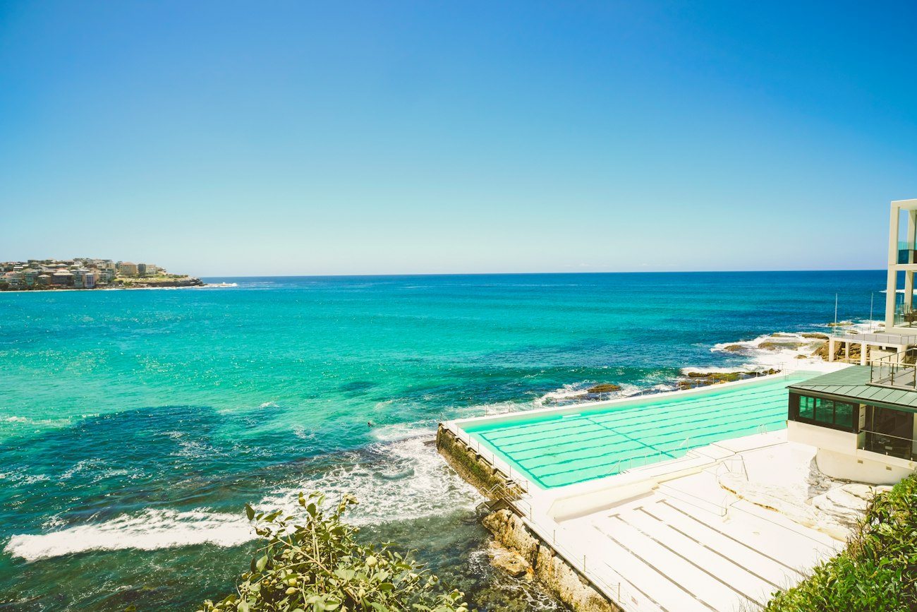 An ocean swimming pool and rocky coast at Bondi